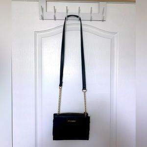 Little black purse, gold accents.